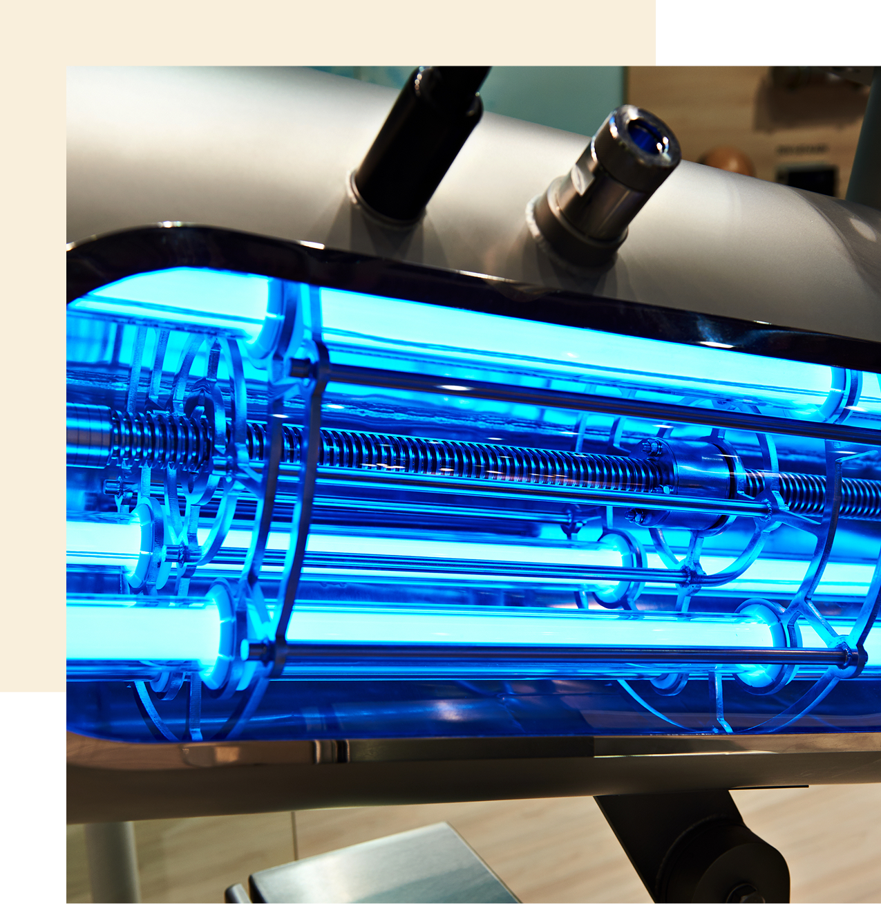 Industrial machine with glowing blue components.